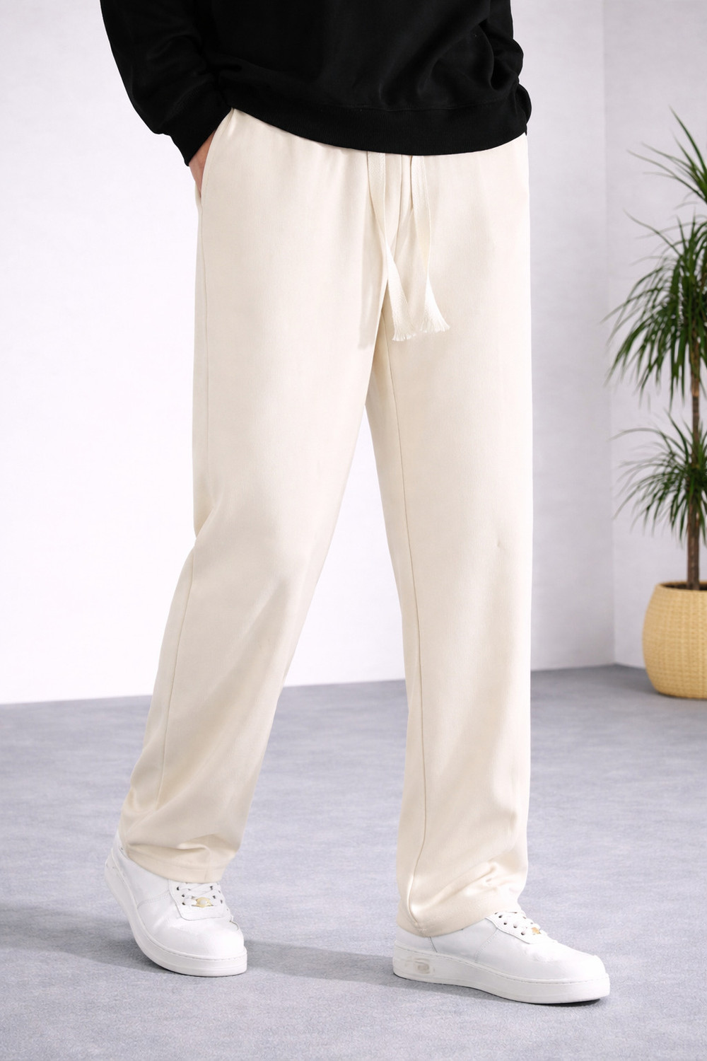 Adokedo Men Solid Beige Track Pants - Image 1